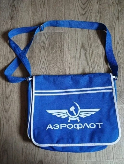 Aeroflot messenger bag in blue with white winged hammer and sickle logo on the flap