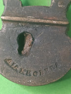 Maker's stamp on the face of a 19th century Russian miniature padlock – detail 5
