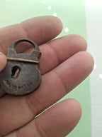 Maker's stamp on the face of a 19th century Russian miniature padlock – detail 8