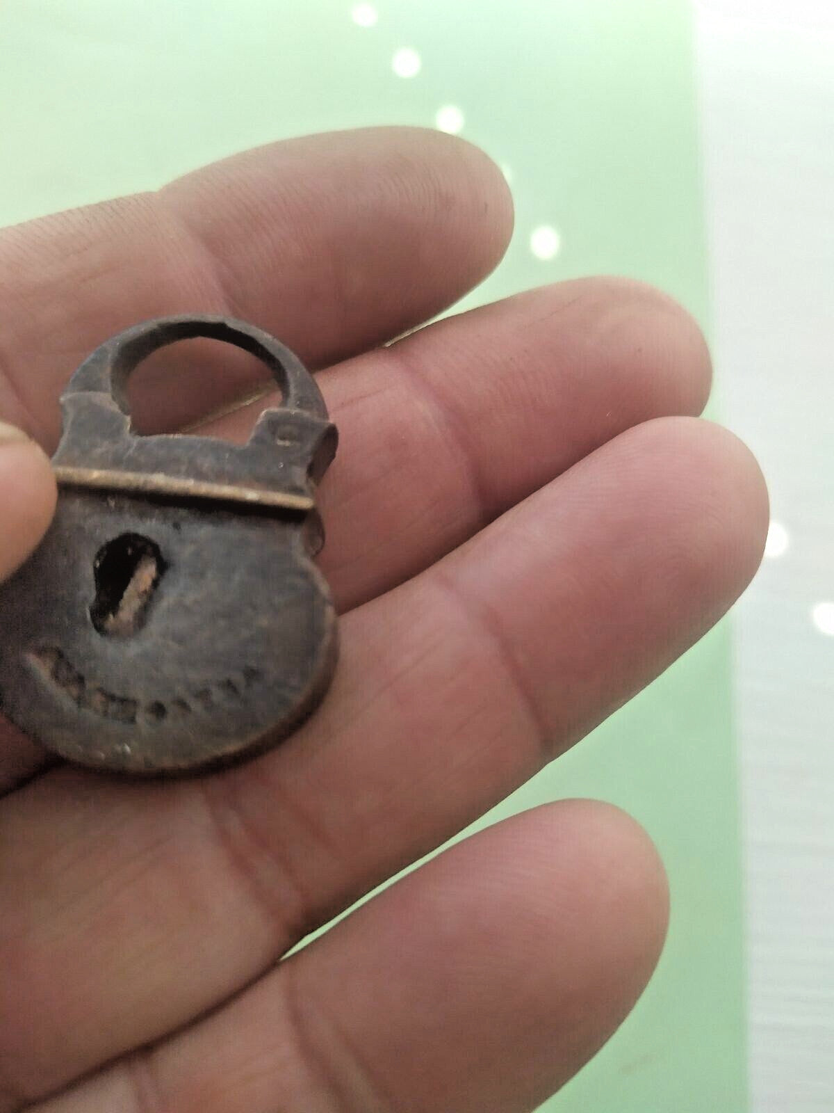Maker's stamp on the face of a 19th century Russian miniature padlock – detail 8