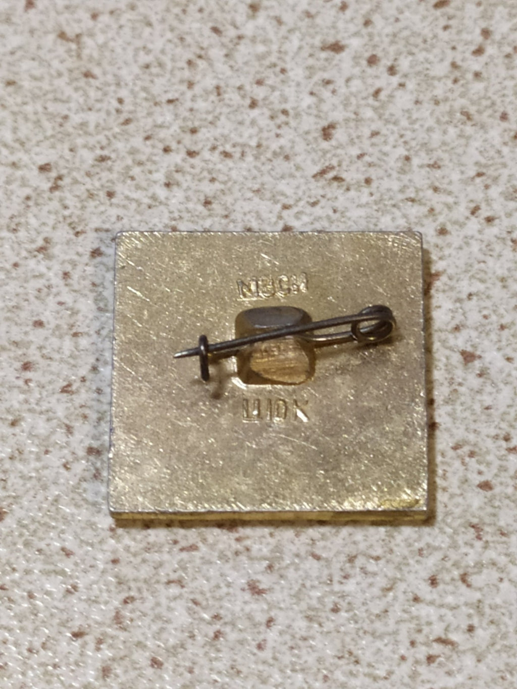 Old Soviet badge reverse showing aluminum construction