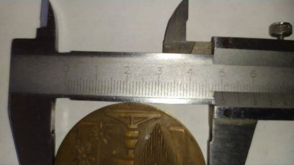 Reverse of the USSR ČSSR table medal with gas flame and pipeline design