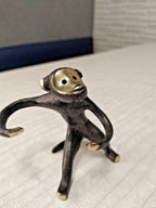 Bronze monkey salt and pepper caddy seen from the side