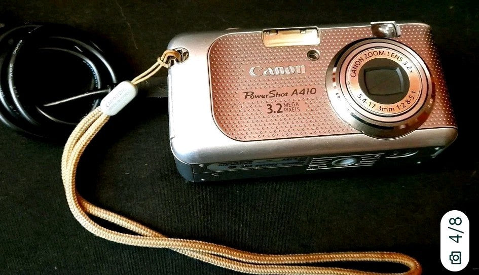 Canon PowerShot A410 3.2MP vintage digital camera with silver body