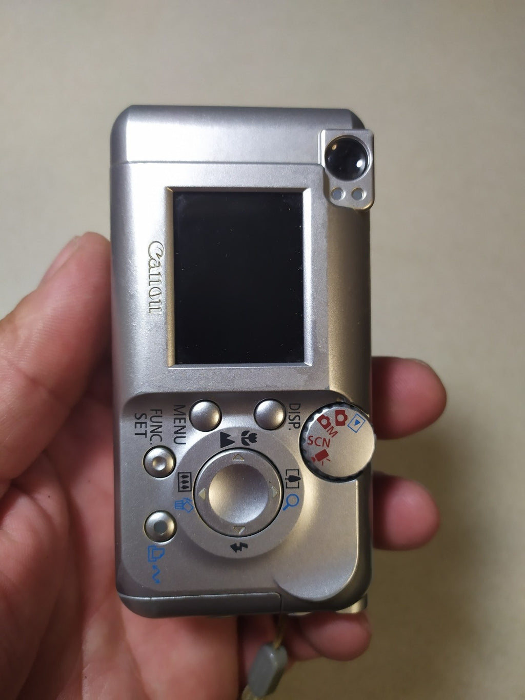Silver Canon PowerShot A410 vintage digital camera, front view – detail 14