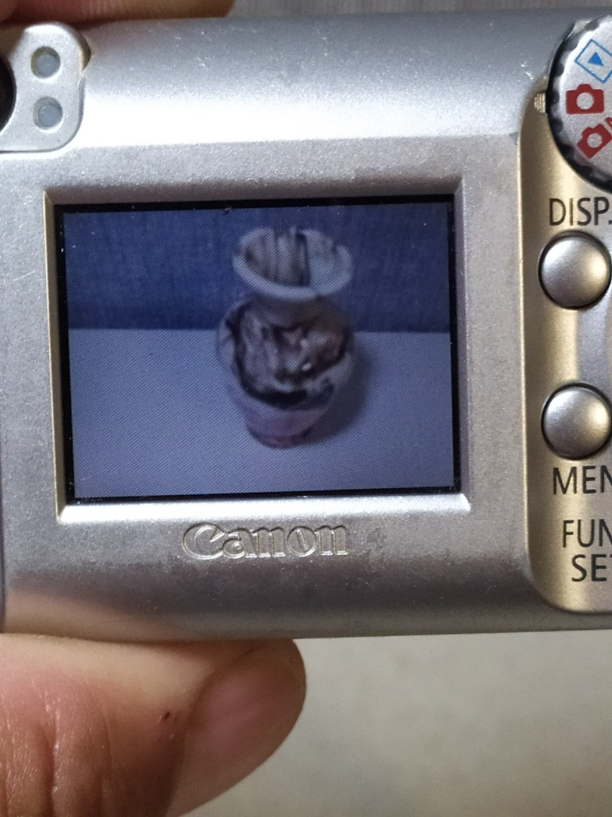Silver Canon PowerShot A410 vintage digital camera, front view – detail 17