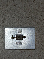 Reverse side of a Cruiser Aurora pin badge