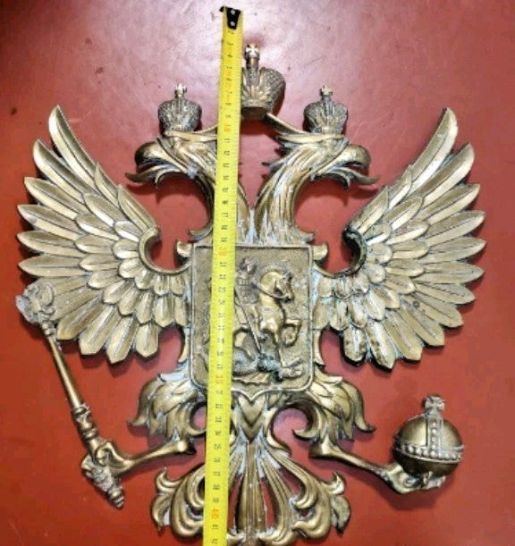 Raised relief of Saint George slaying the dragon on the central shield