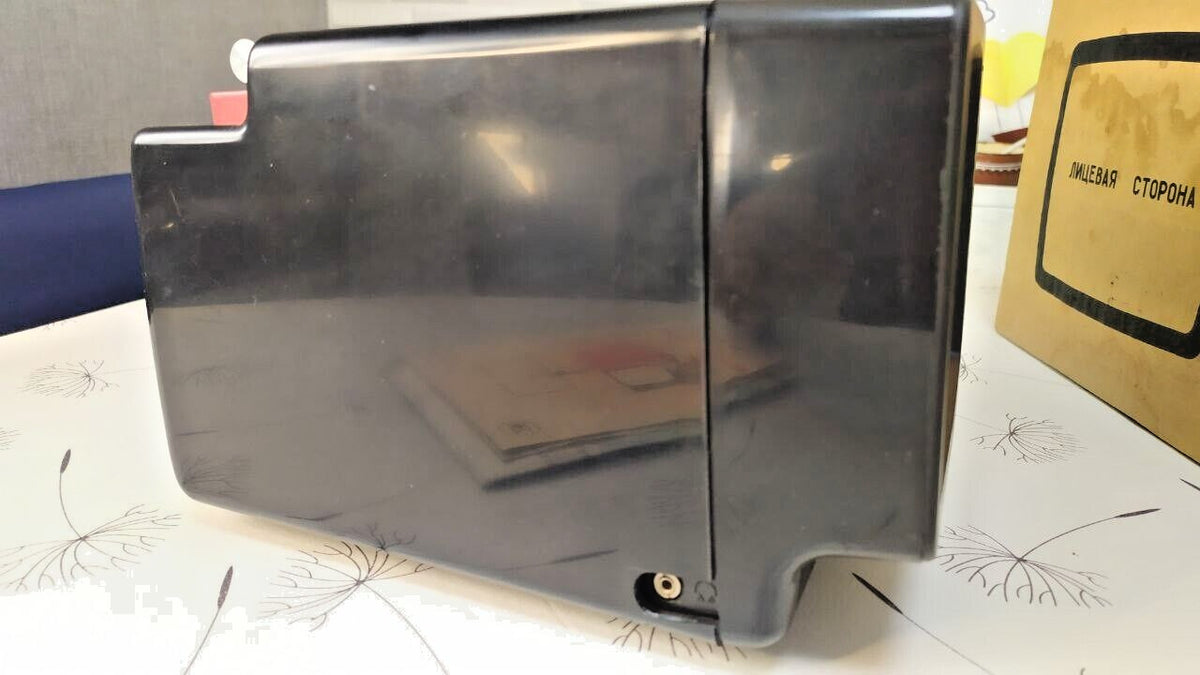 Soviet mini TV with detachable antenna and 12V car power adapter