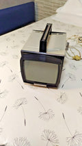 Elektronika VL-100 Soviet portable TV with integrated handle and telescopic antenna