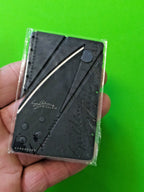 Credit card sized folding knife with matte black stainless steel blade