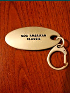 Back of the Fossil keychain with New American Classic slogan