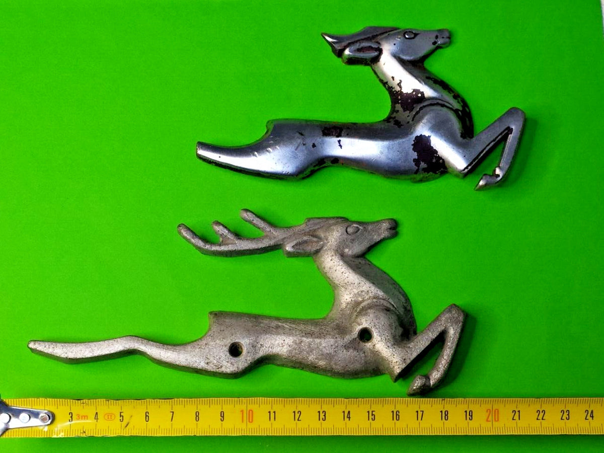 Soviet car parts: two cast metal deer figures measured at about 20 cm