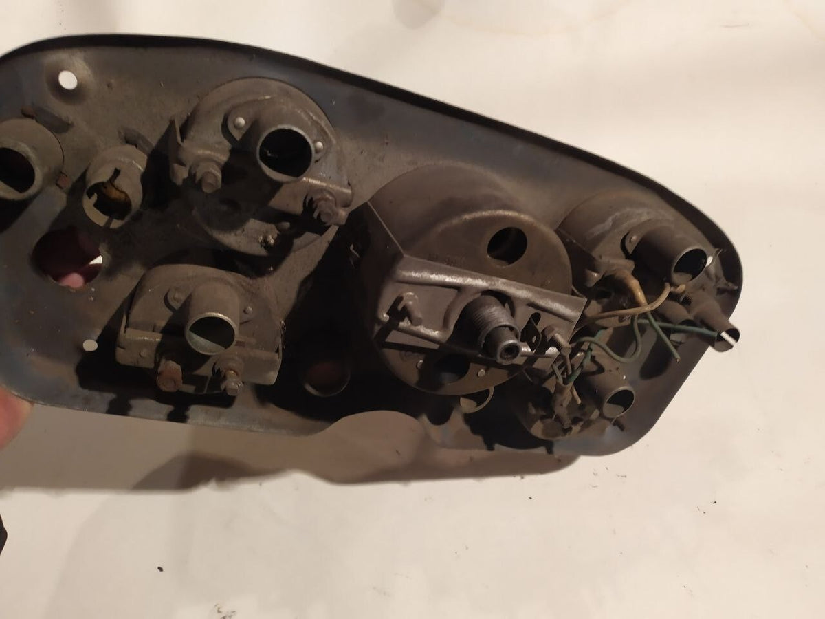 Rear of the GAZ-53 gauge cluster with original housings and bulb sockets – detail 7