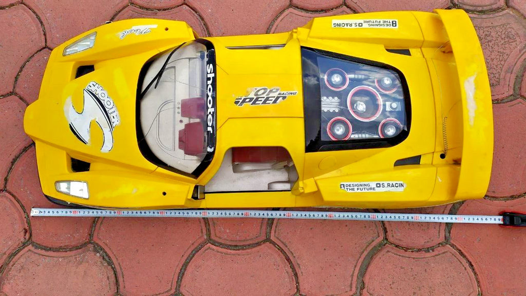 Large yellow toy supercar with Shooter and Top Speed decals