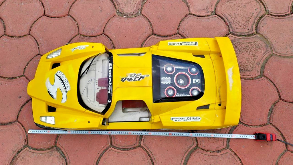 Toy racing car cockpit with two-tone seats and steering wheel