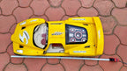 Giant toy car measured with tape, nearly one meter long