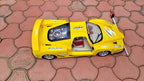 Toy racing car cockpit with two-tone seats and steering wheel – detail 9