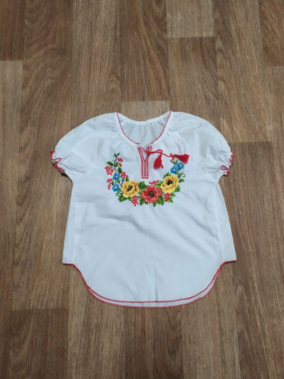 Girls vyshyvanka blouse with embroidered wreath of red poppies, sunflowers and cornflowers