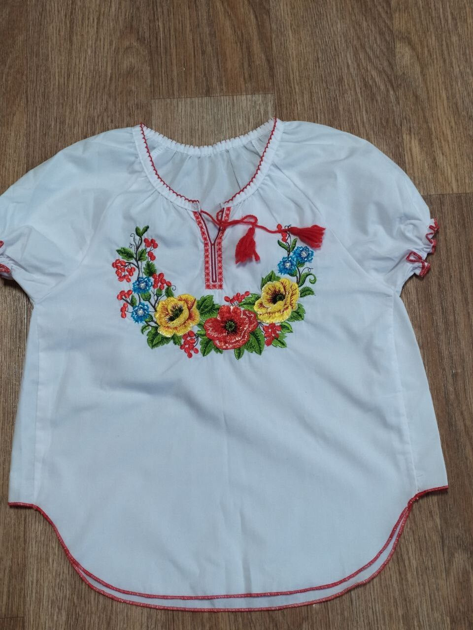 Ukrainian embroidered blouse neckline with red tassels and cross-stitch – detail 5