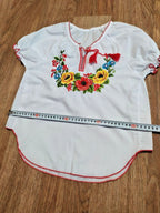 Ukrainian folk blouse laid flat with measuring tape – detail 7