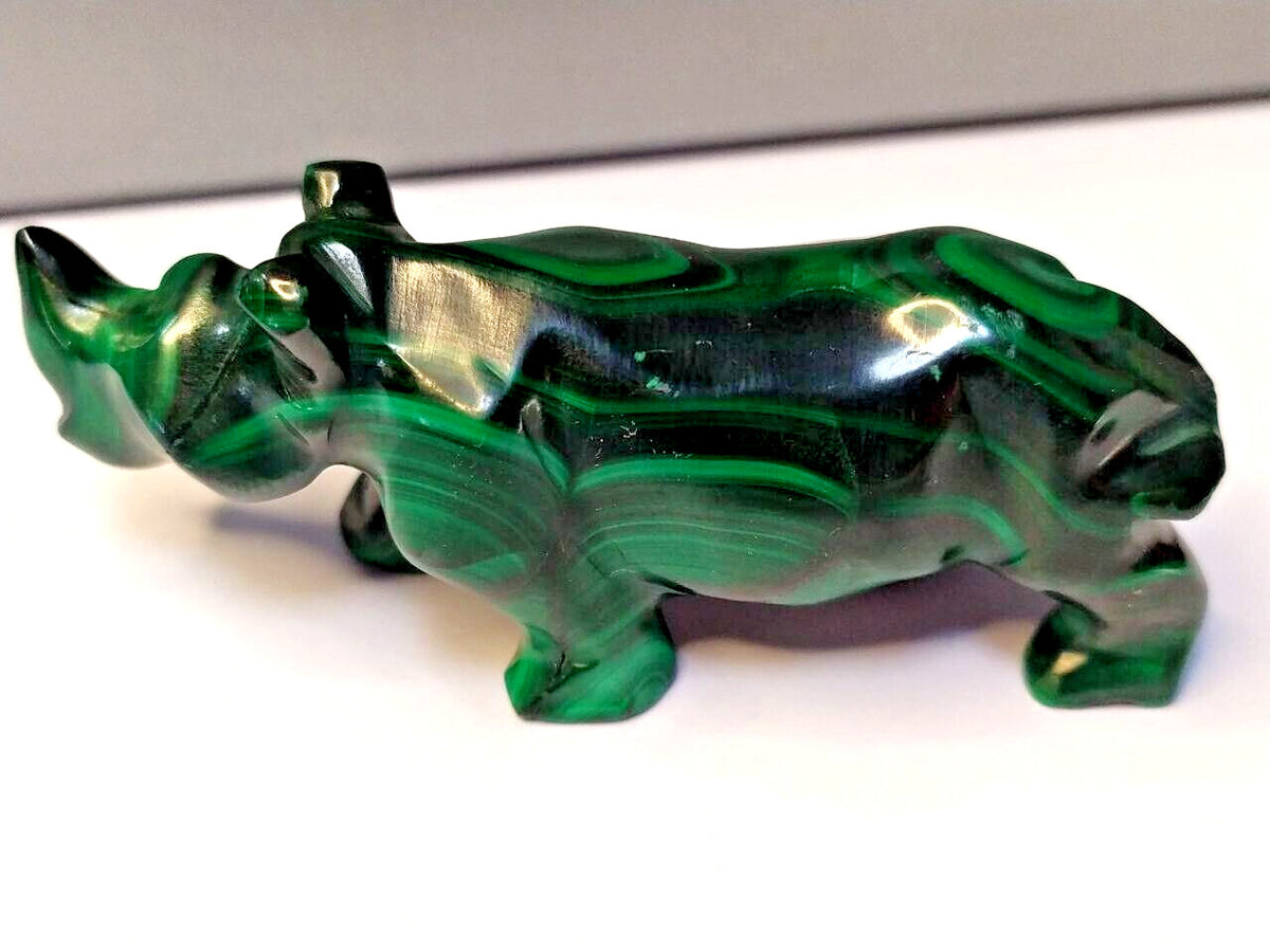 Hand carved malachite rhinoceros figurine with green banded pattern