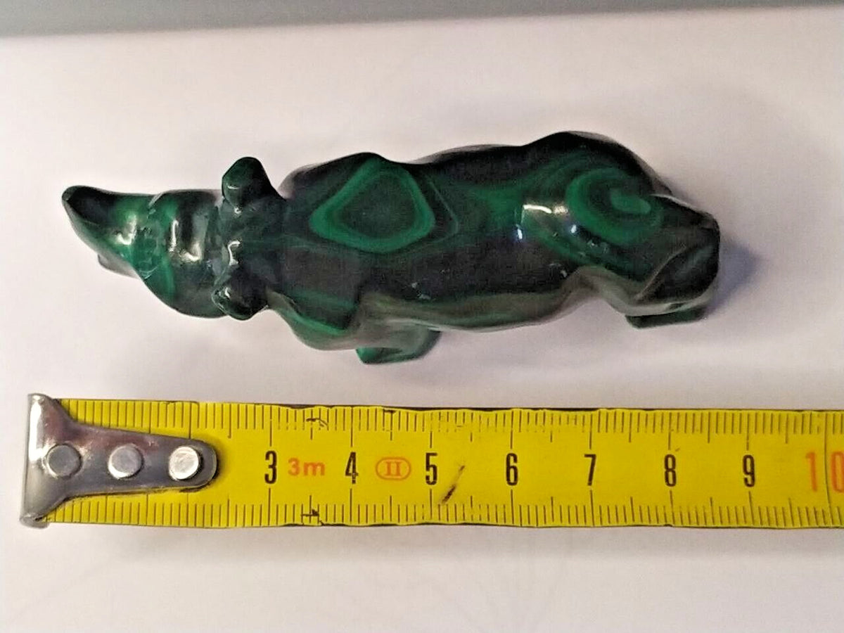 Natural malachite banding close-up on the carved rhinoceros – detail 13
