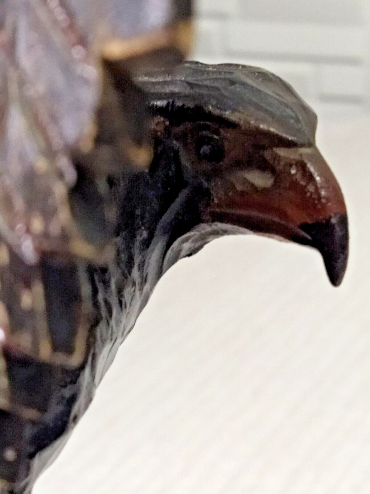 Crack and scuffs on back of left wing of carved eagle – detail 13