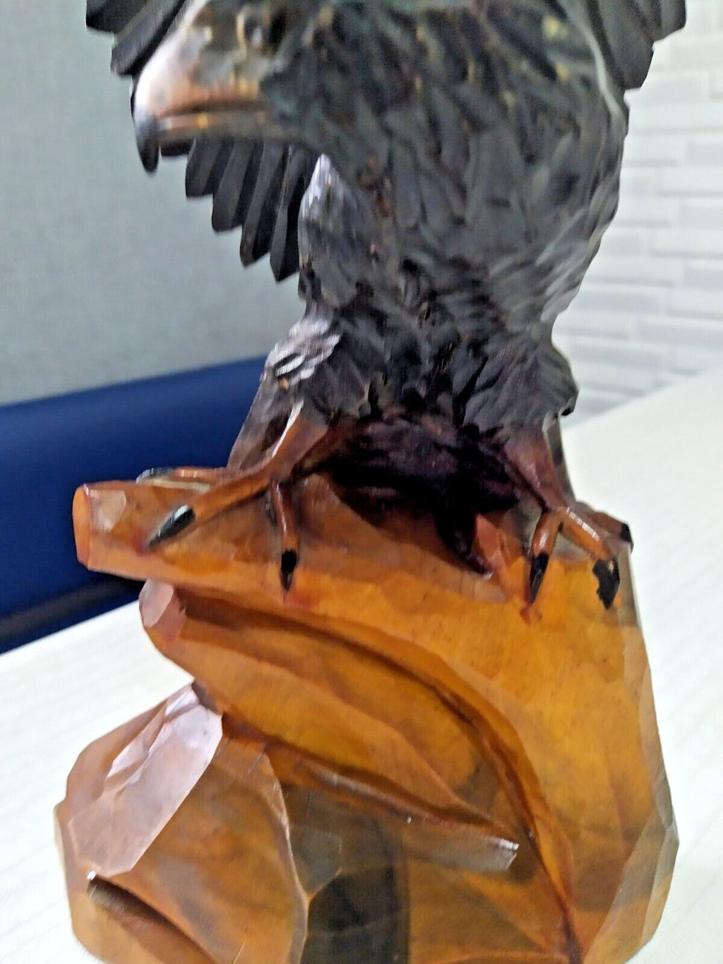 Vintage wood carving faceted feather detail close-up