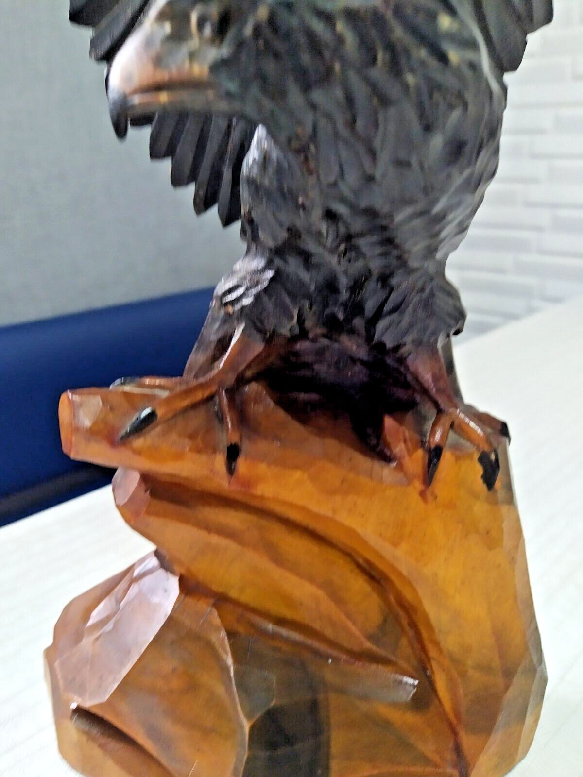 Vintage wood carving faceted feather detail close-up