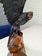 Crack and scuffs on back of left wing of carved eagle