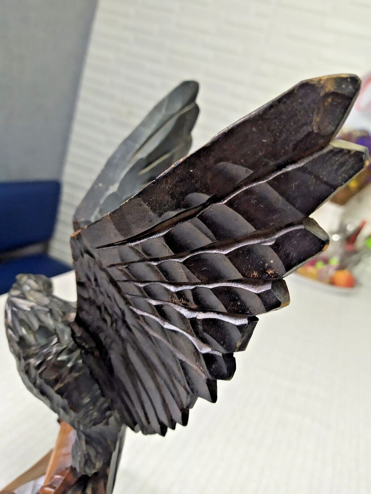Crack and scuffs on back of left wing of carved eagle – detail 7