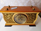 Kobzar Soviet mantel clock with wooden case and gold-tone relief decoration