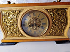 Soviet mantel clock dial with Roman numerals and gold-tone floral relief