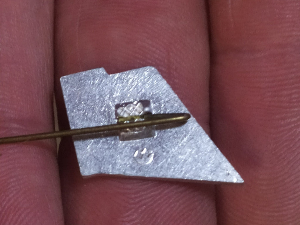 Soviet enamel pin naming the Arsenal Factory in Kyiv – detail 5