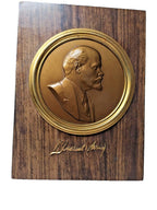 Soviet Lenin relief portrait in a circular frame with raised signature