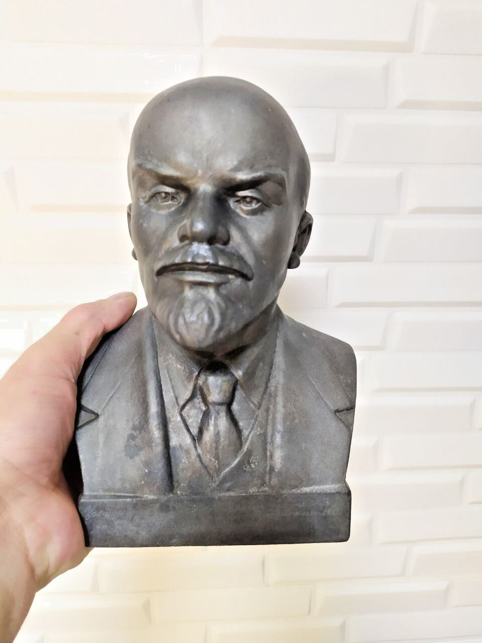 Vintage Lenin bust side profile showing cast metal detail
