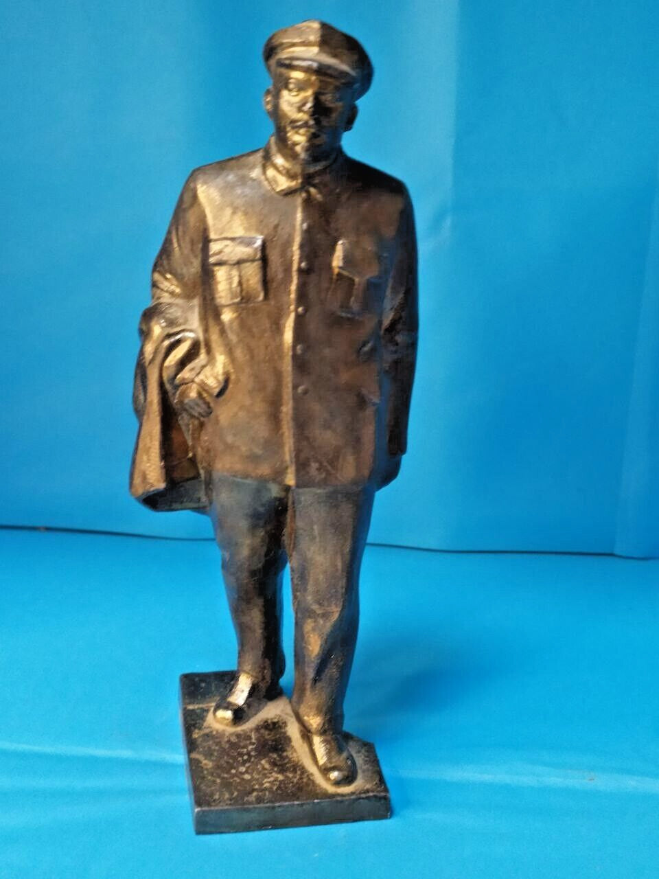 Soviet Lenin statue in silumin showing walking pose with cap and coat