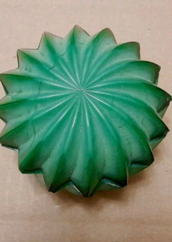Pressed glass powder jar in malachite green, palm-sized vanity piece