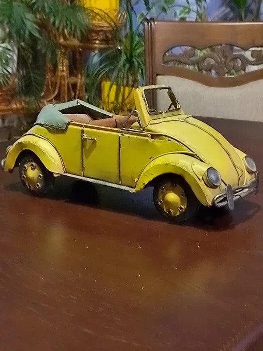 Handmade metal Volkswagen Beetle convertible model in yellow with grey soft-top, 30 cm long
