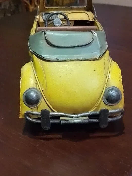 Metal VW Beetle model interior with dashboard and steering wheel