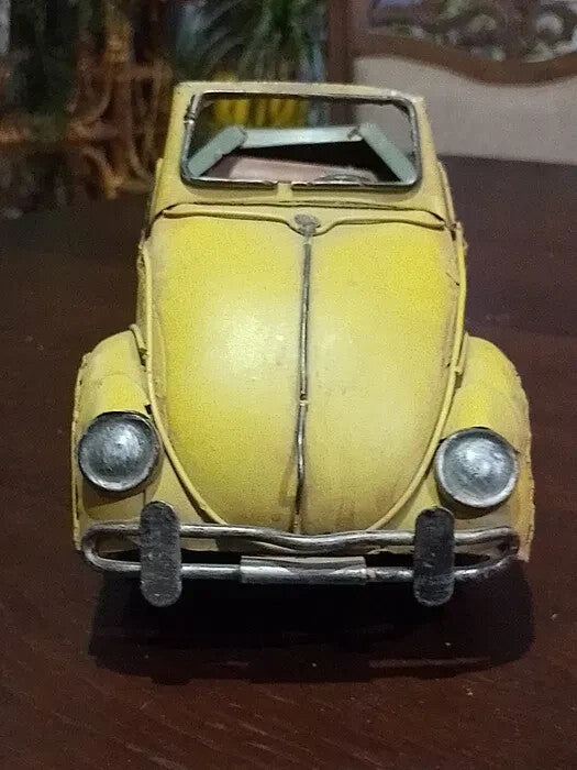 Underside of vintage-style metal car model with X 402 stamp