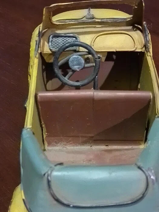 Yellow tin Beetle convertible model with exposed welds and hand-painted finish – detail 5