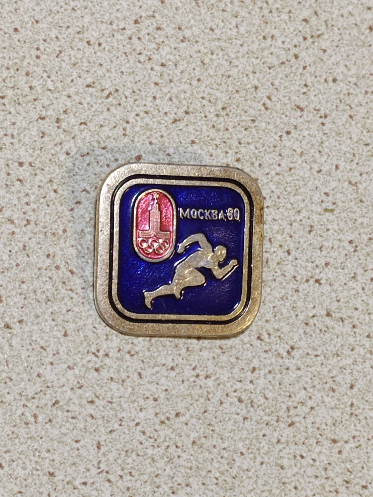 Moscow 80 Olympic Games badge with running track and field athlete, enamel pin