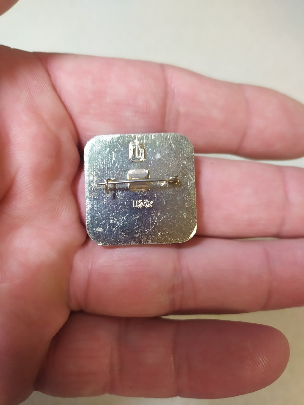 Reverse side of the Moscow 80 football pin