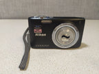 Nikon Coolpix S2700 old digital camera in black, front view