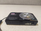 Light scratches around the lens frame of the Nikon compact camera