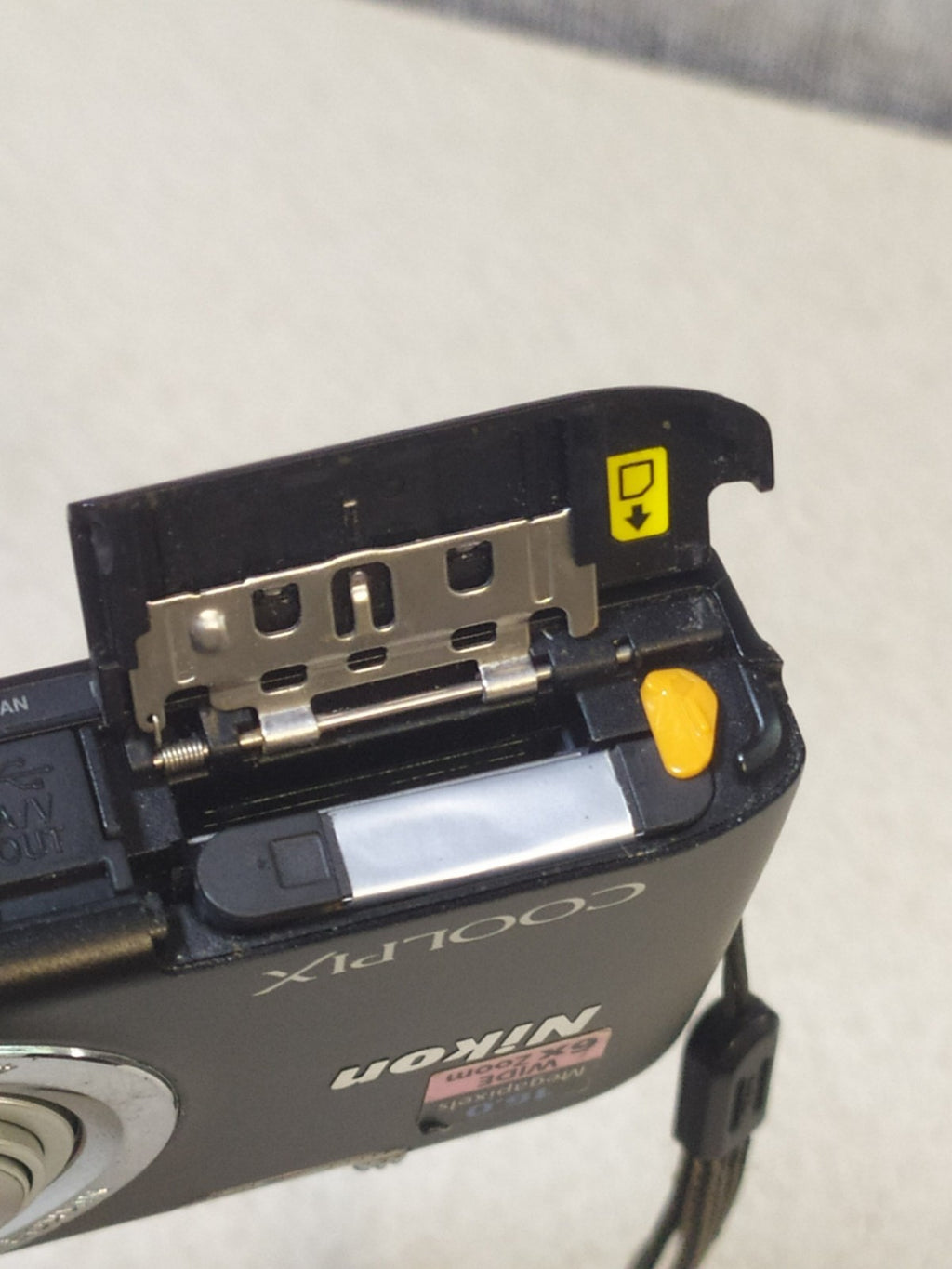 Digital camera for parts with wrist strap attached