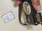 Light scratches around the lens frame of the Nikon compact camera – detail 9