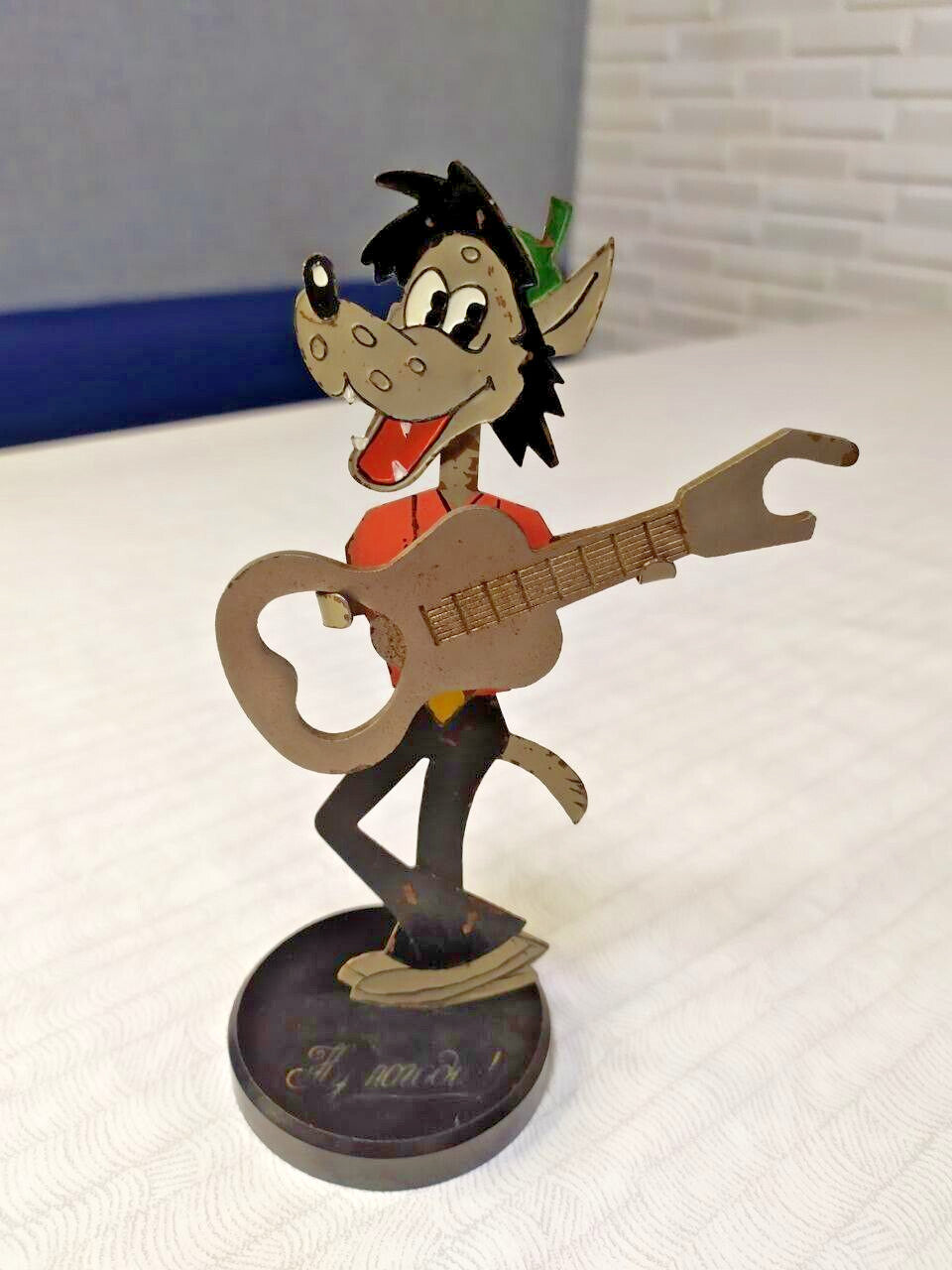 Embossed Ну, погоди! inscription on the base of the Soviet souvenir
